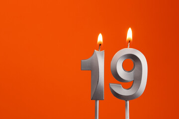 Candle number 19 - Birthday in orange background