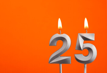 Candle number 25 - Birthday in orange background