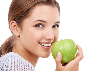 Take a bite of natures goodness. A young beautiful woman holding a green apple.