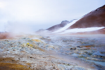 Geothermal Area in Iceland, Volcanic Activity near Myvatn lake, Pure Green Energy at Sulfur Valley with Smoking Fumaroles. Famous tourist spot Hverir. Evaporating water. 