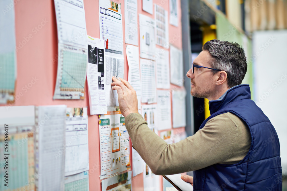 Poster organized and efficient. a man working in a large warehouse.