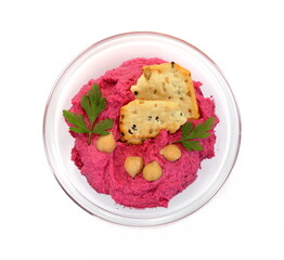 Beet hummus in a bowl isolated on white background 