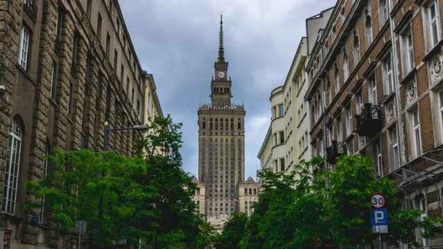 Time lapse of heavy rain clouds rolling behind Palace of Culture and Science viewed from Emilii Plater street