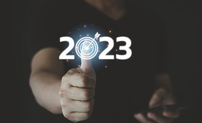 2023 and target icon on the virtual screen. Success and business target concept, project management, and company strategy development. We are targeting the business concept.