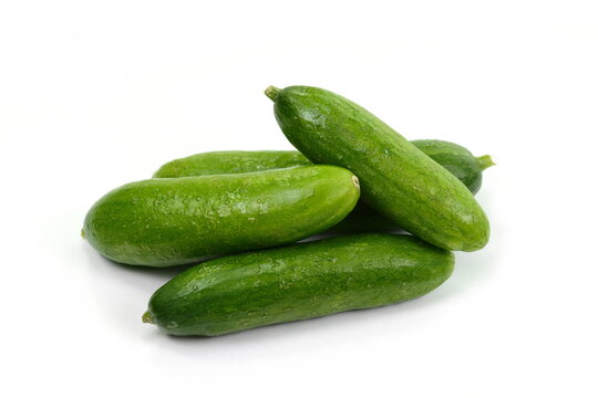 Fresh green cucumber isolated on white