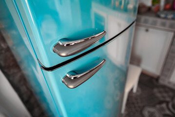 Retro refrigerator freezer standing on the kitchen.