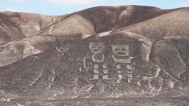 Two human figures called El Shaman de Palpa are part of the newly discovered group of geoglyphs made in the soil of the Nazca Desert in southern Peru