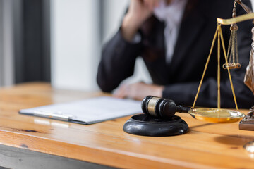 female business woman lawyers working at the law firms. Judge gavel with scales of justice. Legal law, lawyer, documents, advice and justice concept.
