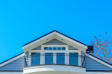 The roof of the house with nice window.