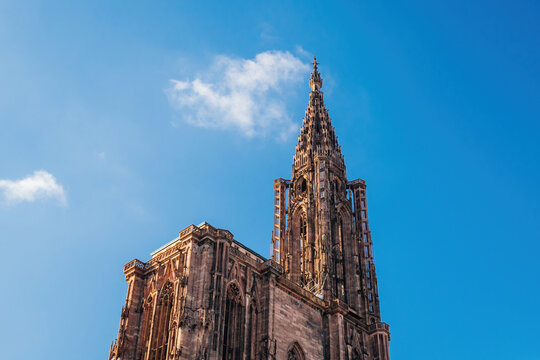 Strasbourg Notre Dame cathedral low anglew view - A breathtaking landmark this majestic place of worship features a grand tower with an im Notre Dame cathedral low anglew view