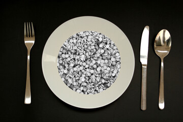 cutlery next to an empty white plate, drugs, white small tablets, vitamins, pills, medicinal background, concept development medicine, pharmacology, drug addiction problems, day medic, overdose