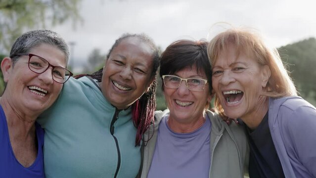 Diverse sport senior women having fun together after exercise workout outdoor at city park