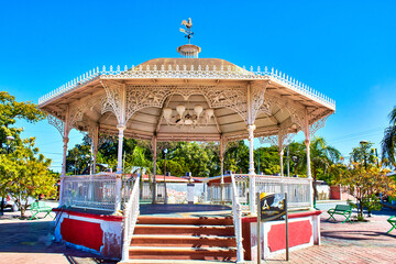 kiosk surrounded by trees in square at sunny day, isla aguada campeche mexico 