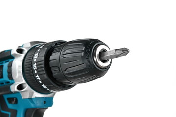 Battery screwdriver or drill isolated over white background. Powerful cordless drill screwdriver on...