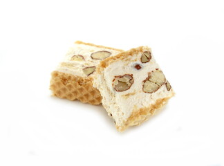 French soft nougat with strawberry flawour and almonds isolated on white background. Greek manolato. White nougat bar isolated.