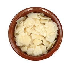 Parmesan cheese flakes in a bowl isolated on white background. Pile of parmesan cheese flakes and crumbs isolated on white background. Square pieces of Italian parmigiano reggiano for salads and pasta