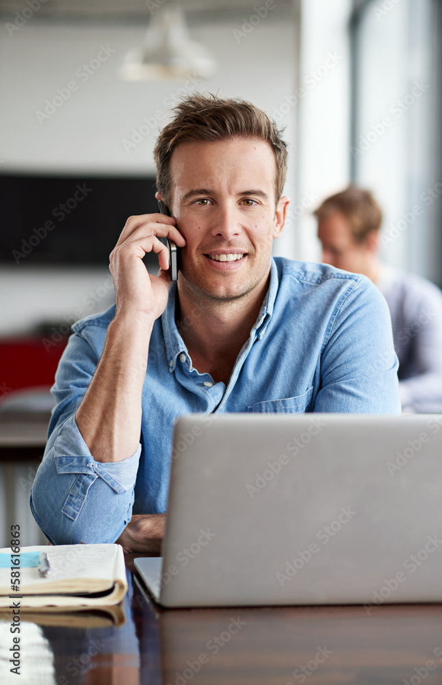 Poster my clients needs are top priority. a man talking on his cellphone in a casual work environment.