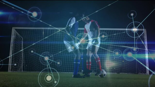 Animation of network of connections with icons over diverse football players kicking ball on pitch