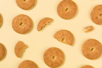 Group of tasty cookies or biscuit on yellow background.