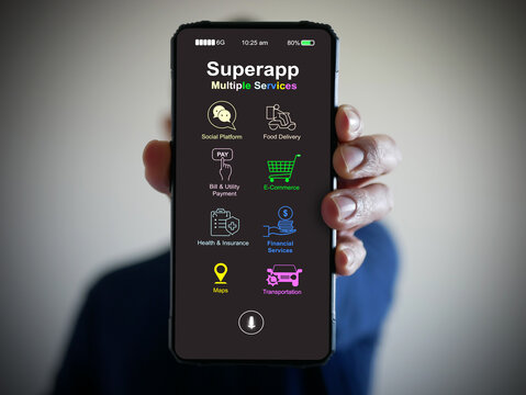 Hand holds a smartphone with a super app for mobile phones that serves multiple services as a one-stop service.