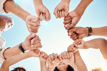 Hands, family and unity with a group of people in a huddle outdoor in nature during summer...
