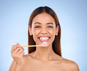 Toothbrush, portrait and dental with a woman in studio on a blue background for oral hygiene....