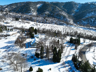 A UAV Drone Aerial View of Oak Glen, California, after a major Winter Snow Storm