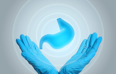 Symptoms and treatment of heartburn and other gastrointestinal diseases. Doctor holding stomach...
