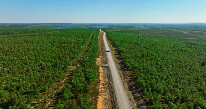 Drone shot following a RV driving in remote wilderness of Kevo, Northern Finland