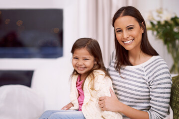 Shes the dearest to me. Portrait of a mother and her little daughter spending quality time together at home.