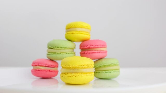 Close up of colorful macarons cakes. Small French cakes. Sweet and colorful dessert with vintage pastel tones. . High quality photo
