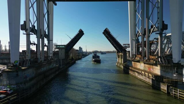 The Drawbridge being opened for the big container ship navigating through the dutch canals in Dordrecht.