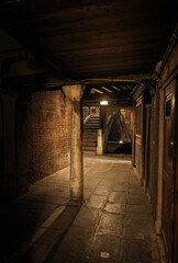Fototapeta na wymiar narrow empty street in Venice Italy
