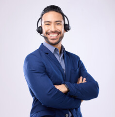 Portrait, customer service and arms crossed with a man consultant standing in studio on a gray...