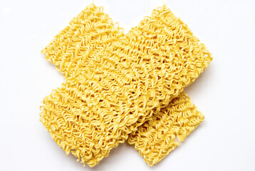 cross-shaped noodles which illustrates not consuming too much instant noodles because it can trigger various health problems