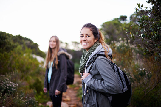 Time for an adventure. two attractive young female hikers in the outdoors.