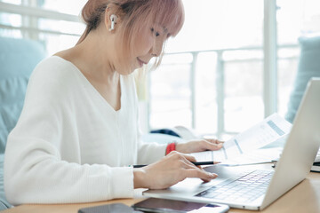 Woman checking credit card billing information