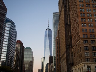 The One World Trade Center towers 1,776 feet above Manhattan as dusk falls on New York City