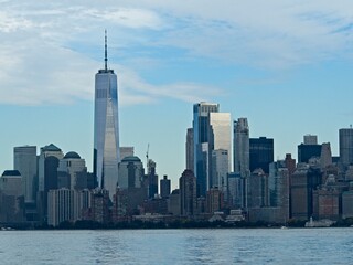 Looking back on Manhattan from the Hudson River and Liberty Island, as the towering high rises of...