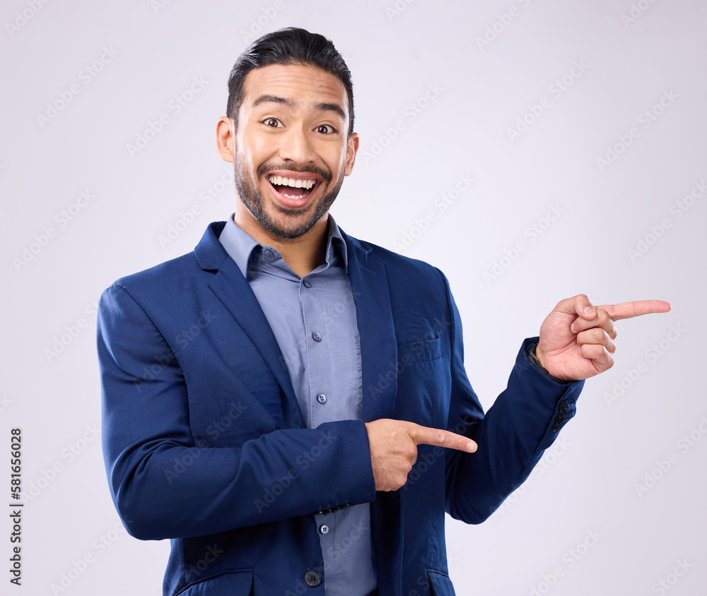 Poster happy, portrait and man in a studio pointing to mockup for marketing, advertising or product placeme