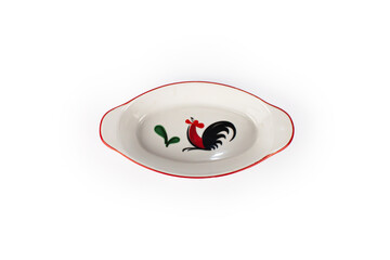 A white plate with a rooster design on it