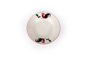 A white plate with a rooster design on it