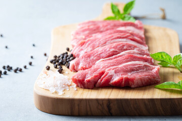 fresh raw meat on cutting board	