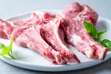 Raw lamb ribs on a plate	