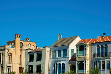 Row of decorative house facades in downtown histroic districts of san francisco california with copy space blue sky