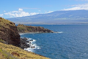 Waves crash on the rocky shores of the southern part of the western half of the Hawaiian island of Maui