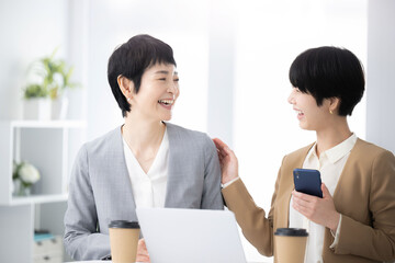 Business team of Asian women. Meeting and conference scene.