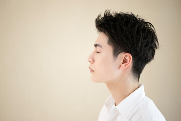 Close-up of a young Asian man's face For skin care and beauty images