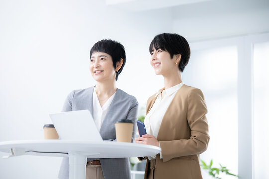 Image of a female business team looking at goals and the future Copy space available