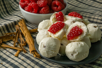 fresh goat cheese balls with raspberries